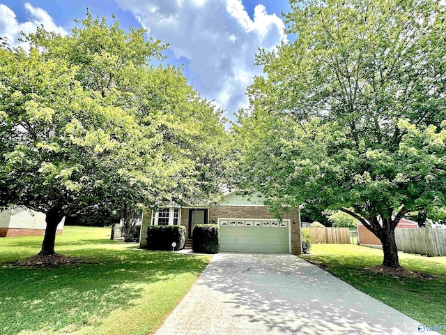 209 Leslie Ln, Harvest, AL 35749 - obstructed view of property with an attached garage, brick siding, and concrete driveway