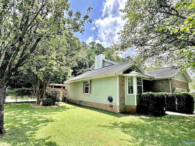 209 Leslie Ln, Harvest, AL 35749 - view of side of property featuring crawl space, a garage, and a chimney