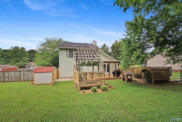 209 Leslie Ln, Harvest, AL 35749 - rear view of house featuring a storage shed, a fenced backyard, a wooden deck, and a chimney