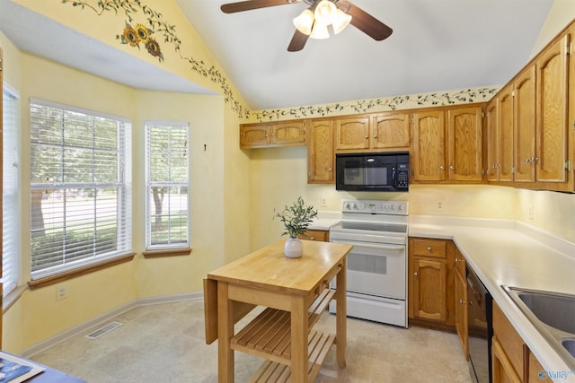 209 Leslie Ln, Harvest, AL 35749 - kitchen with black appliances, ceiling fan, lofted ceiling, light countertops, and brown cabinetry