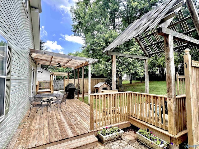 209 Leslie Ln, Harvest, AL 35749 - deck featuring outdoor dining area, a fenced backyard, a pergola, ceiling fan, and area for grilling