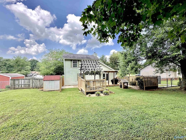 209 Leslie Ln, Harvest, AL 35749 - rear view of house featuring a shed, a fenced backyard, a deck, and a chimney