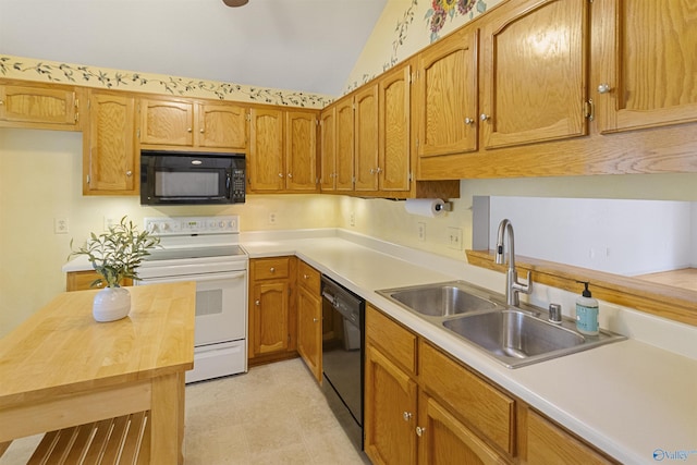 209 Leslie Ln, Harvest, AL 35749 - kitchen with black appliances, lofted ceiling, and brown cabinets