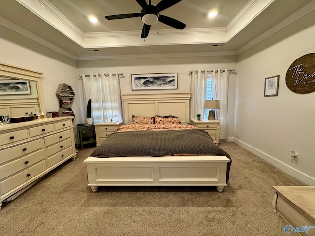 bedroom with baseboards, visible vents, crown molding, a raised ceiling, and carpet flooring