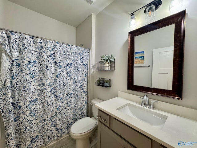 bathroom featuring a shower with shower curtain, toilet, and vanity