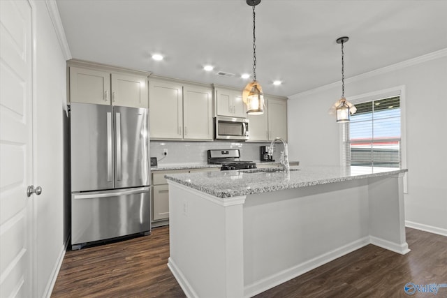 kitchen with appliances with stainless steel finishes, light stone countertops, dark hardwood / wood-style flooring, sink, and an island with sink