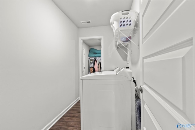 clothes washing area featuring independent washer and dryer and dark hardwood / wood-style floors