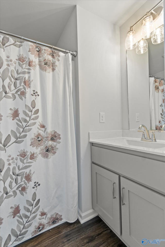 bathroom featuring vanity and hardwood / wood-style flooring