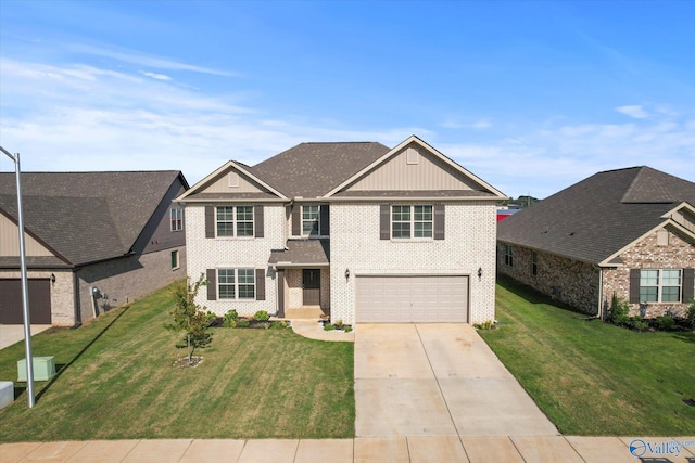 view of front of property featuring a garage and a front lawn