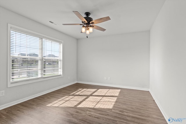 unfurnished room with ceiling fan and hardwood / wood-style floors