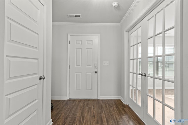 interior space with ornamental molding, french doors, and dark hardwood / wood-style flooring