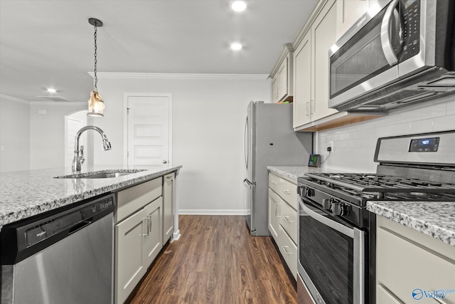 kitchen featuring appliances with stainless steel finishes, dark hardwood / wood-style flooring, sink, and light stone countertops