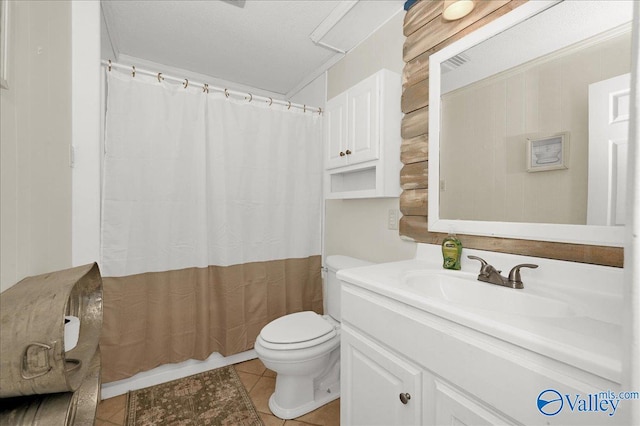 bathroom featuring toilet, vanity, and tile patterned floors