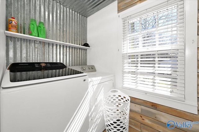 laundry room featuring laundry area, plenty of natural light, and washing machine and clothes dryer