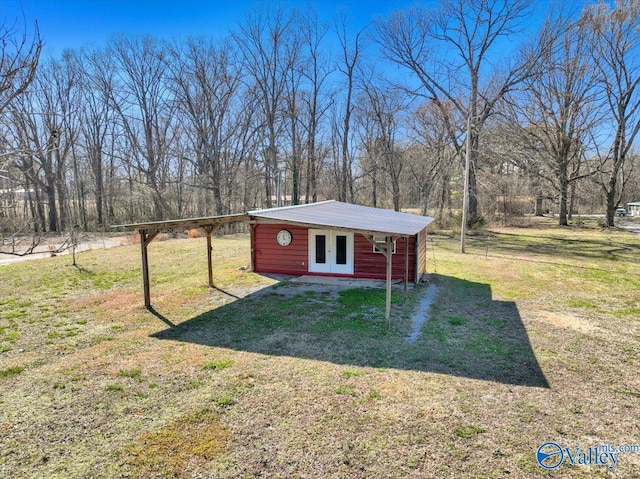 view of outbuilding with french doors and an outdoor structure