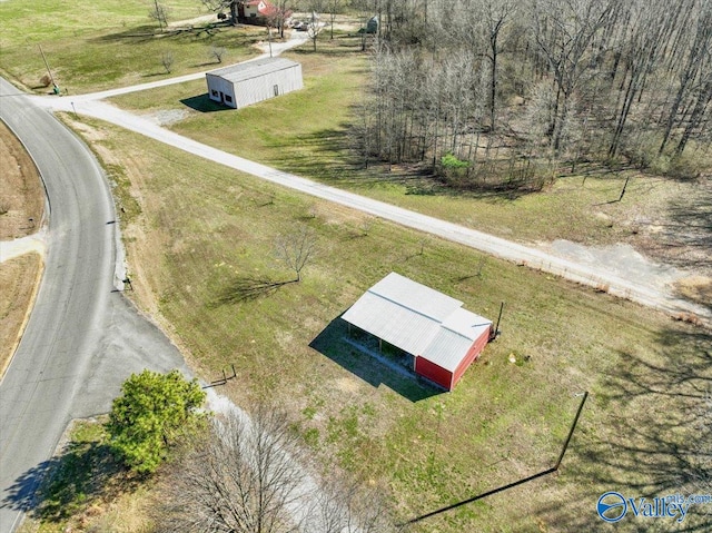 birds eye view of property with a rural view