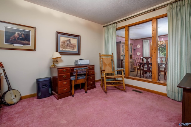 carpeted office with a textured ceiling and a chandelier