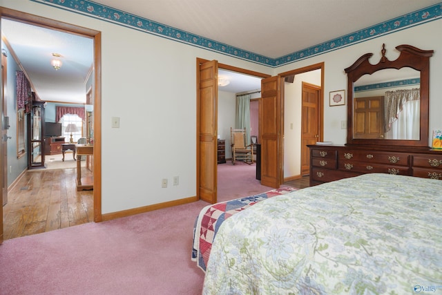 bedroom with hardwood / wood-style flooring