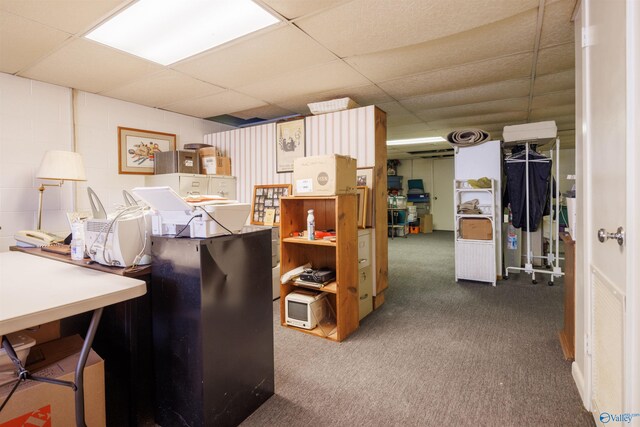 carpeted office featuring a paneled ceiling
