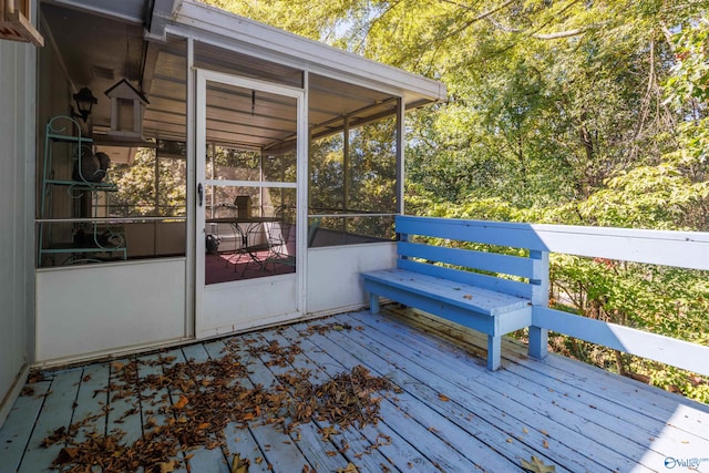 wooden terrace featuring a sunroom