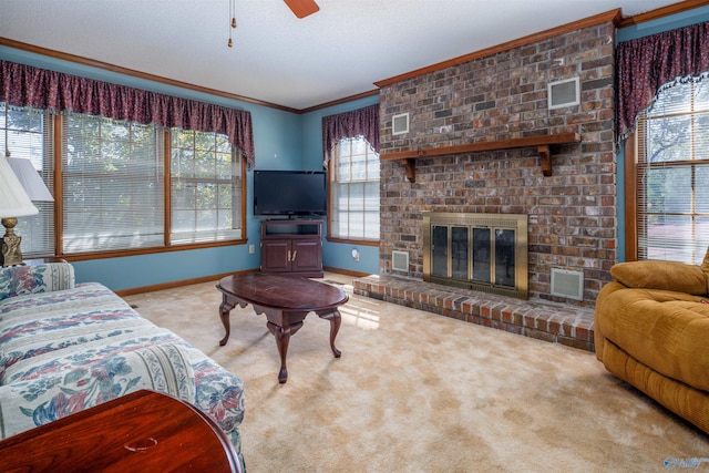 carpeted living room featuring crown molding, plenty of natural light, a fireplace, and ceiling fan
