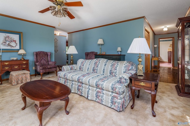 carpeted living room featuring crown molding and ceiling fan
