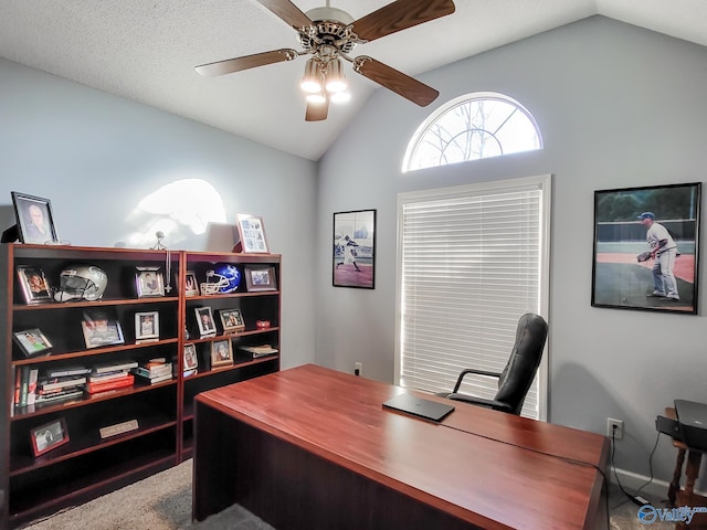 office area featuring lofted ceiling and ceiling fan