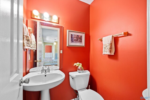 bathroom with sink and toilet