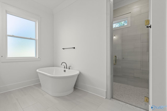 bathroom with shower with separate bathtub