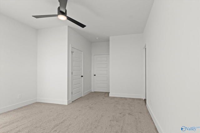 unfurnished bedroom featuring ceiling fan and light carpet