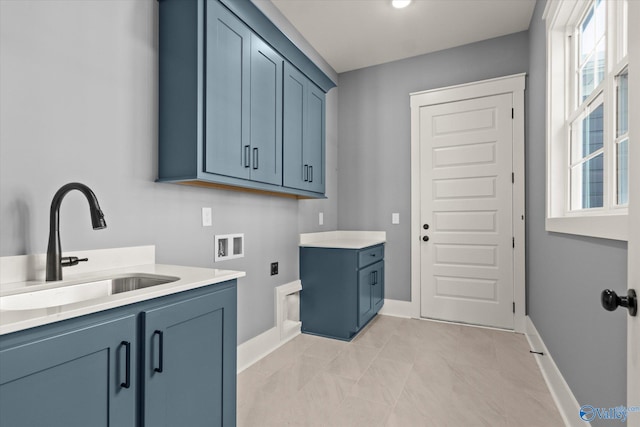 laundry area featuring cabinets, washer hookup, hookup for an electric dryer, and sink