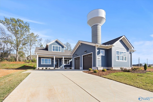 view of front of home featuring a front lawn and a garage