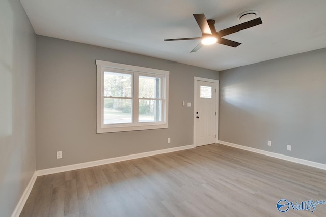 foyer entrance featuring light hardwood / wood-style floors and ceiling fan