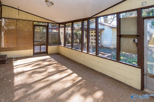 unfurnished sunroom with vaulted ceiling and plenty of natural light