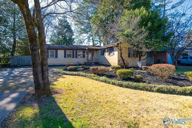 ranch-style house with a front yard