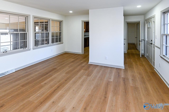 unfurnished room featuring light hardwood / wood-style flooring