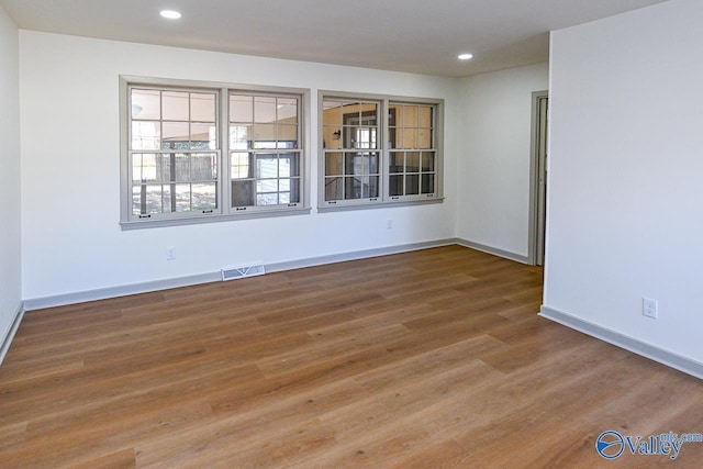 empty room featuring hardwood / wood-style floors