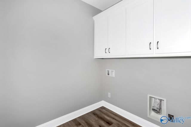 laundry room with cabinet space, baseboards, dark wood-style floors, and washer hookup