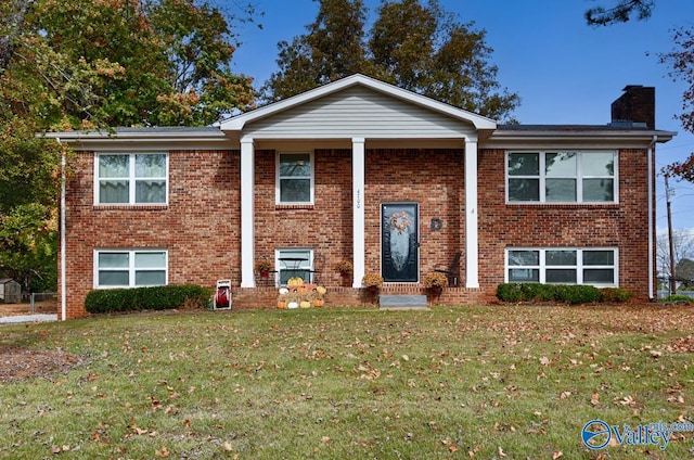 bi-level home with a front yard