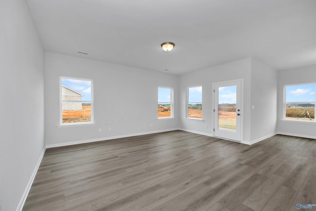 unfurnished room featuring hardwood / wood-style floors