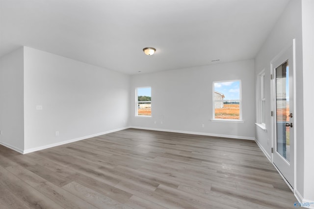 unfurnished room featuring light wood-type flooring