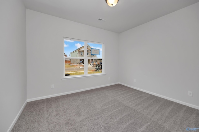 unfurnished room with carpet flooring