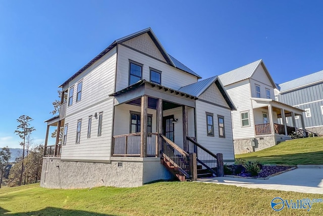 view of front of house with a front lawn and covered porch