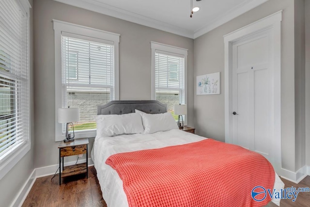 bedroom featuring dark hardwood / wood-style floors and ornamental molding