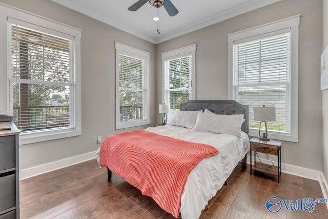 bedroom featuring ornamental molding, hardwood / wood-style flooring, and ceiling fan