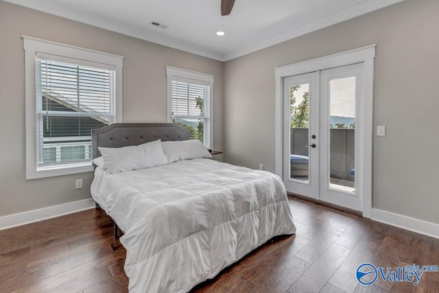 bedroom featuring access to exterior, multiple windows, ceiling fan, and dark hardwood / wood-style flooring