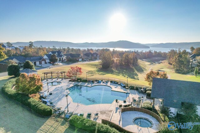 birds eye view of property with a mountain view