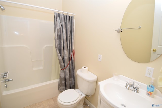 full bathroom with tile patterned floors, vanity, shower / bath combo with shower curtain, and toilet