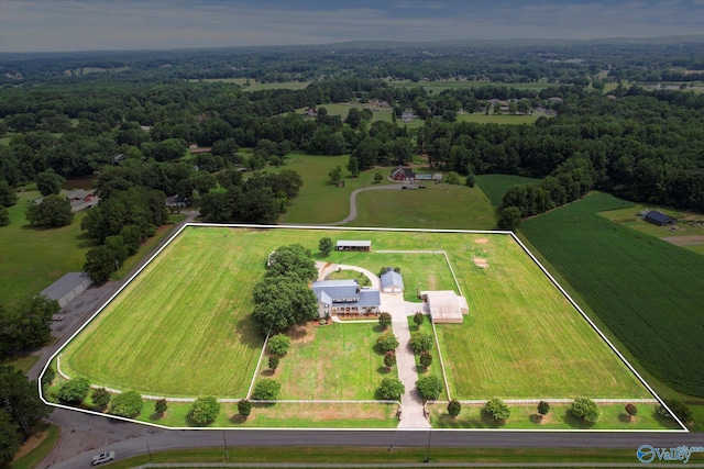 bird's eye view with a wooded view and a rural view