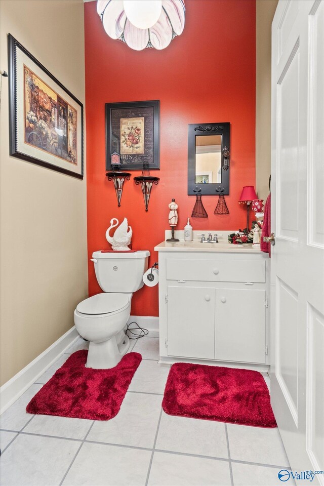 bathroom featuring vanity, toilet, and tile patterned floors